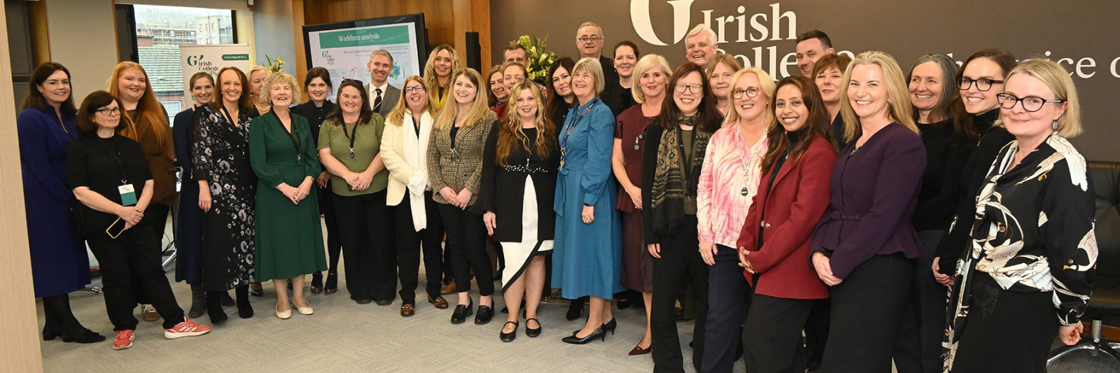 A group of College staff at our official head office opening 2025